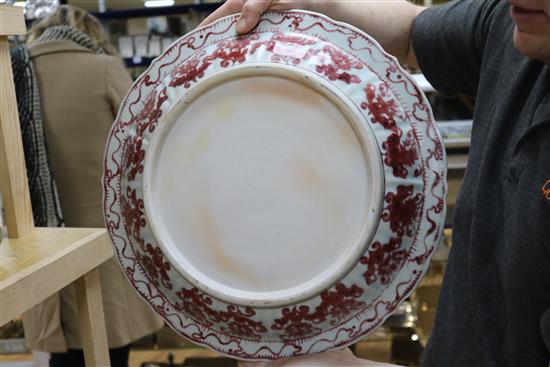 A pair of Chinese Ming-style underglaze copper red dishes, with wooden stands D.44cm